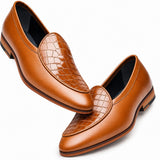 A pair of men's brown leather loafers with a glossy crocodile-embossed toe cap and a smooth side panel, shown on a clean white background.
